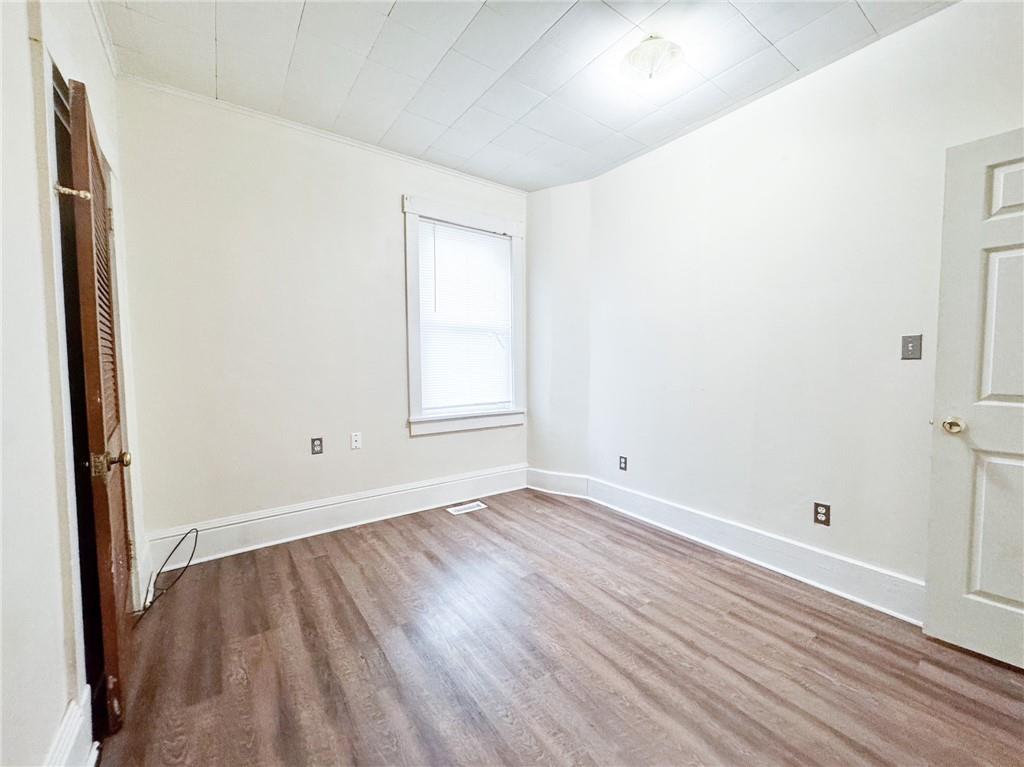 344 South Chestnut Street, Unit 2 Butler, PA 16001 - Photo 8 of 16 an empty room with wooden floor and windows