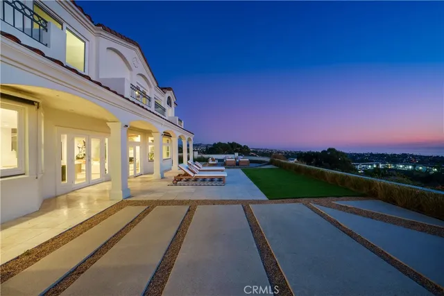a view of a swimming pool with an outdoor seating