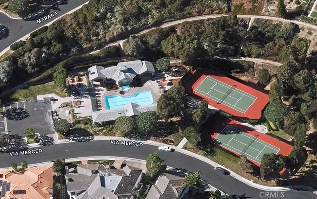 an aerial view of a houses with yard