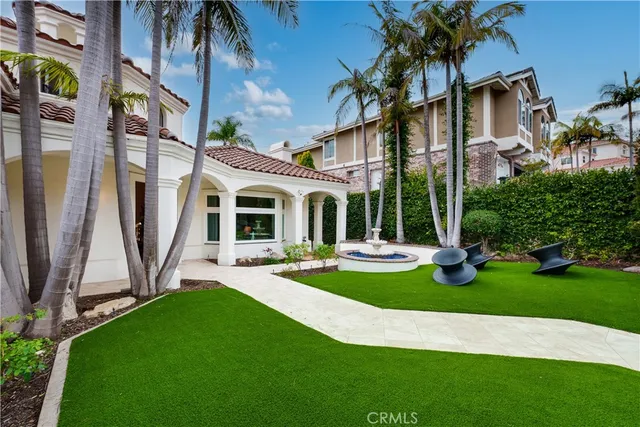 a front view of a house with swimming pool having outdoor seating