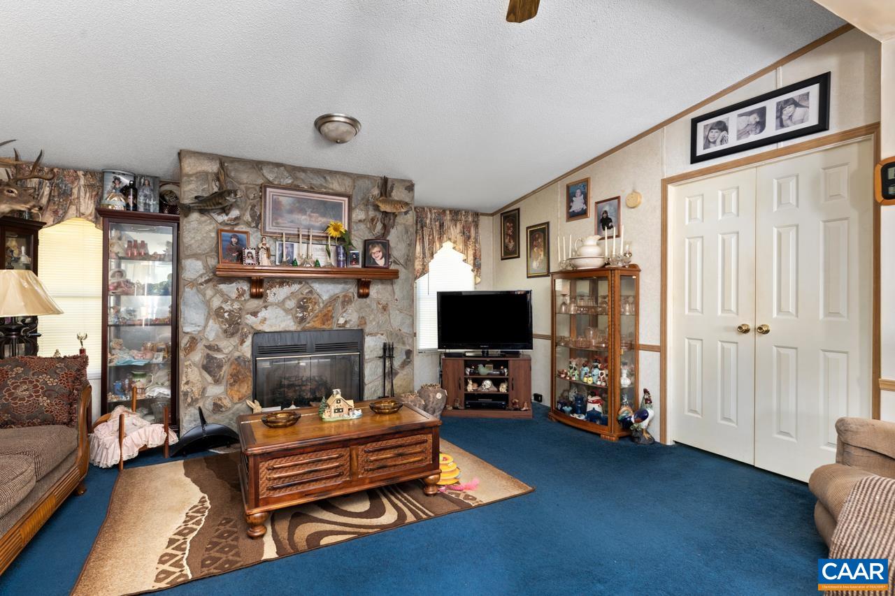 5000 Wheelers Cove Road Shipman, VA 22971 - Photo 23 of 45 a living room with furniture and a flat screen tv
