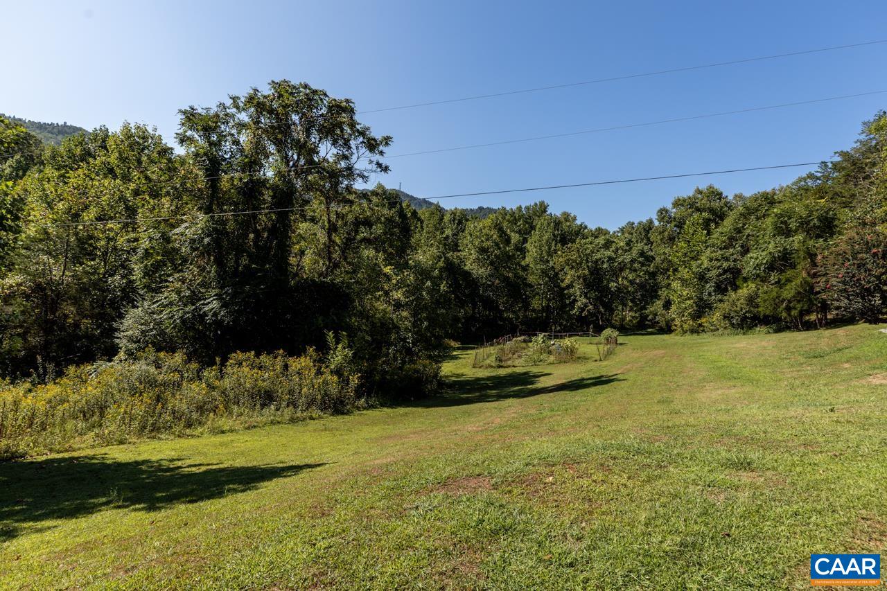 5000 Wheelers Cove Road Shipman, VA 22971 - Photo 5 of 45 a view of a swimming pool with an outdoor space and seating area