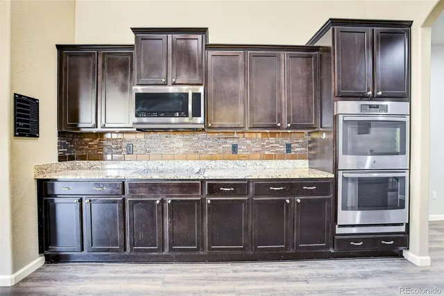 a kitchen with a stove and a microwave