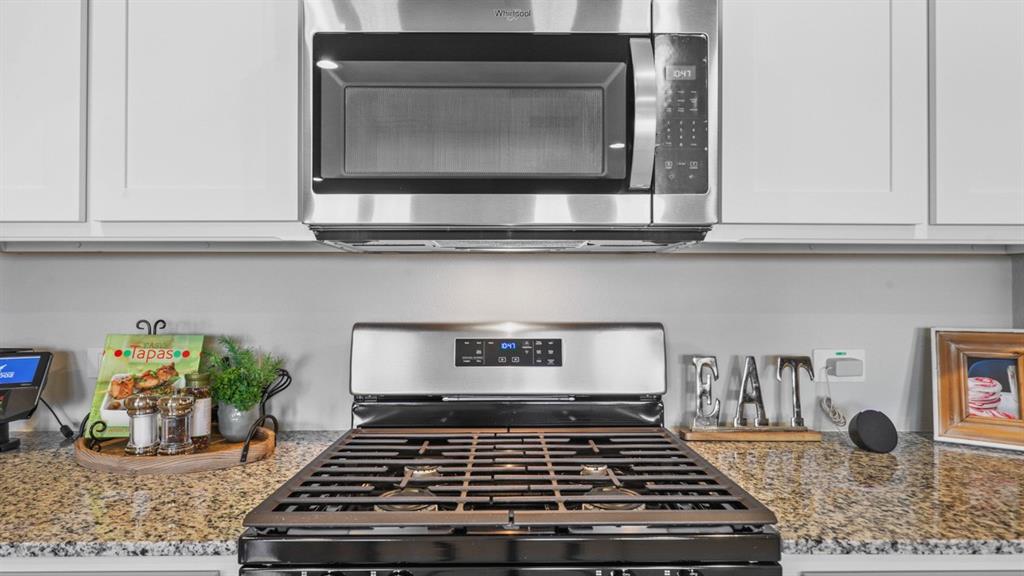 320 Blanco Drive Azle, TX 76020 - Photo 10 of 40 a kitchen with stove and cabinets