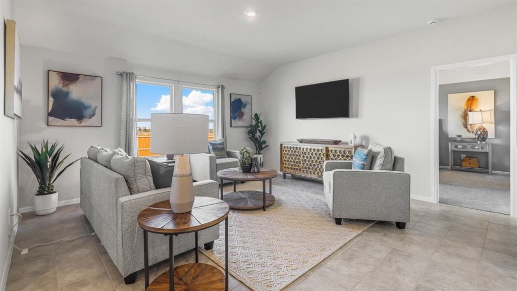 320 Blanco Drive Azle, TX 76020 - Photo 16 of 40 a living room with furniture and a flat screen tv