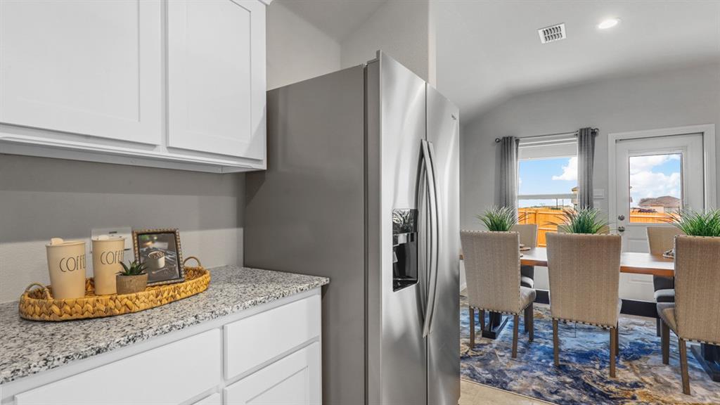 320 Blanco Drive Azle, TX 76020 - Photo 5 of 40 a kitchen with granite countertop cabinets and stainless steel appliances