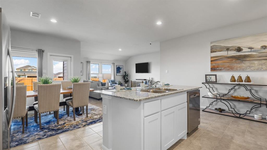 320 Blanco Drive Azle, TX 76020 - Photo 6 of 40 a view of a dining room kitchen counter top space and a living room