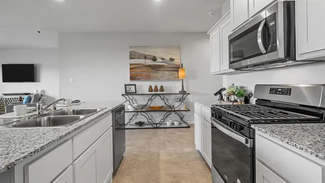a view of a dining room kitchen counter top space and a living room