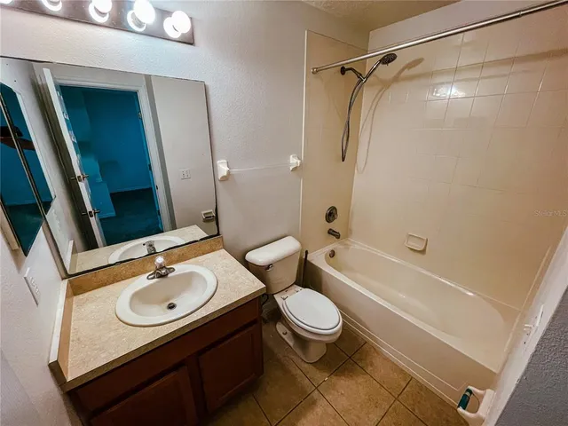 an empty room with a empty space and windows