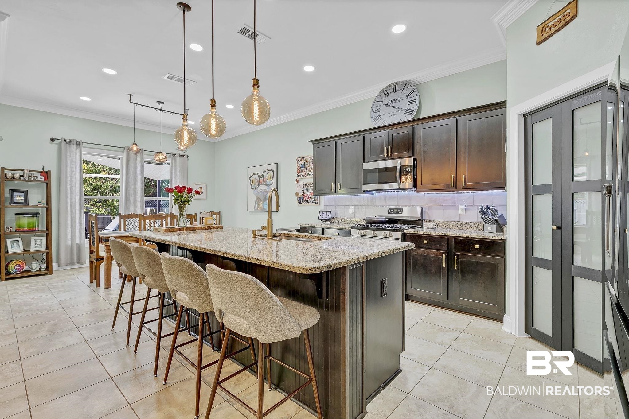 30635 Drayton Court Daphne, AL 36527 - Photo 13 of 51 Kitchen with stainless steel appliances, a sink, light tile patterned floors, decorative backsplash, and recessed lighting