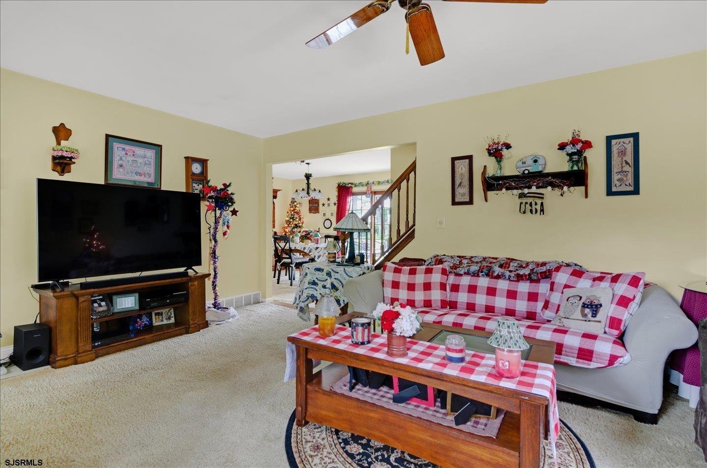 419 Crow Pond Road Elmer, NJ 08318 - Photo 9 of 60 a living room with furniture and a flat screen tv