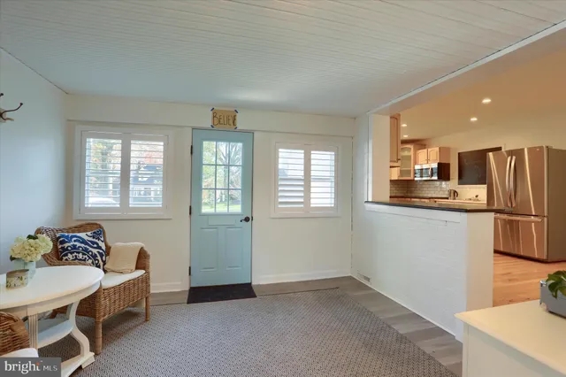 a room with a table and cabinets
