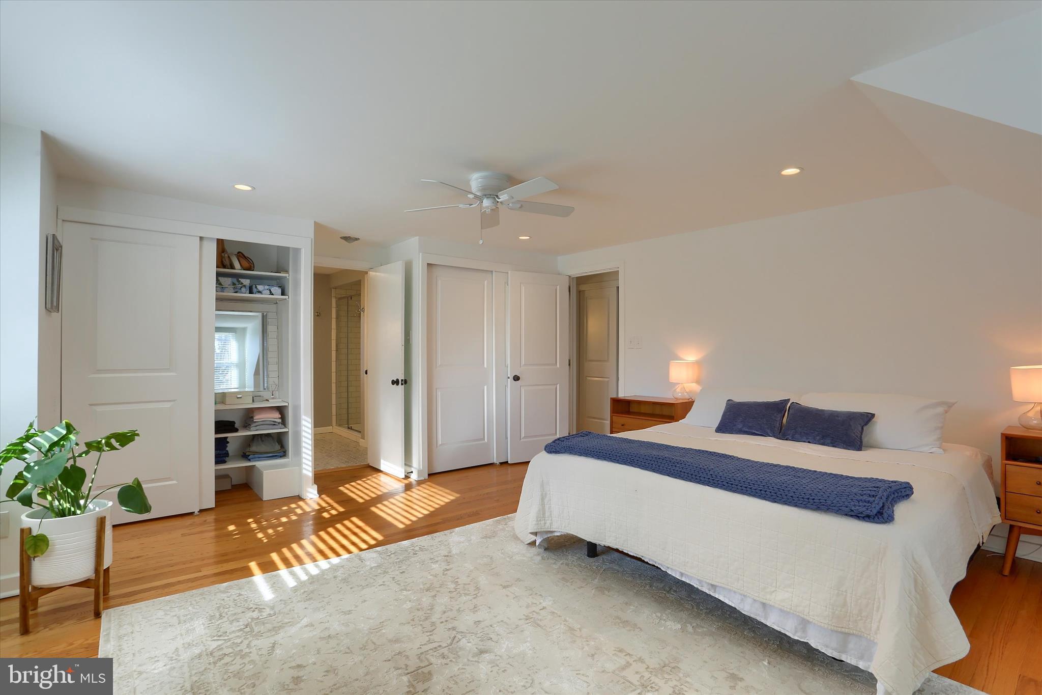 155 Oak Lane Hershey, PA 17033 - Photo 21 of 54 a spacious bedroom with a bed and potted plant