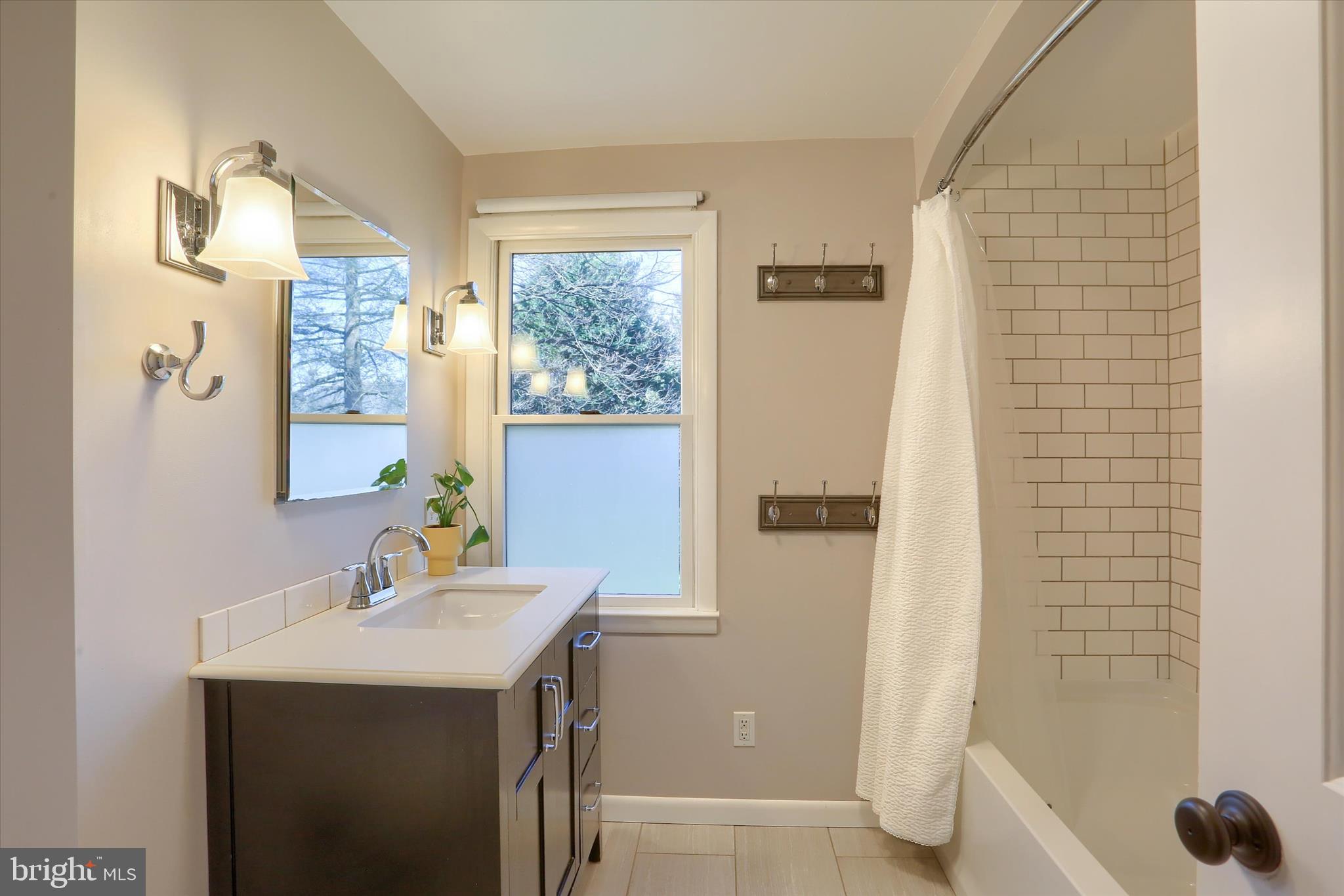 155 Oak Lane Hershey, PA 17033 - Photo 25 of 54 a bathroom with a sink and a mirror