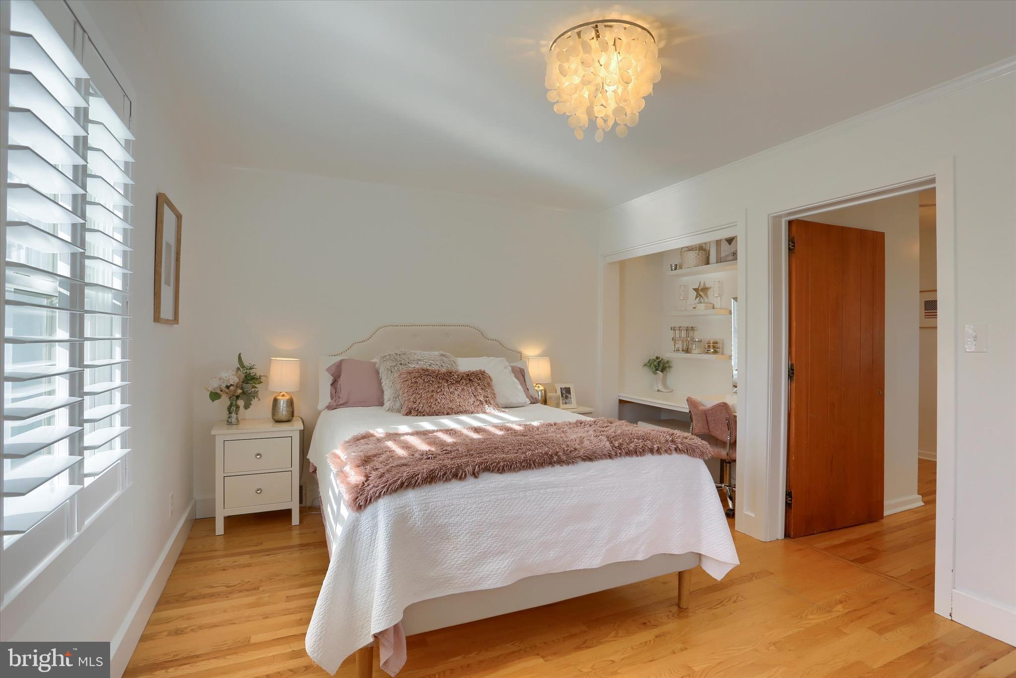 155 Oak Lane Hershey, PA 17033 - Photo 33 of 54 a bedroom with a bed and a chandelier