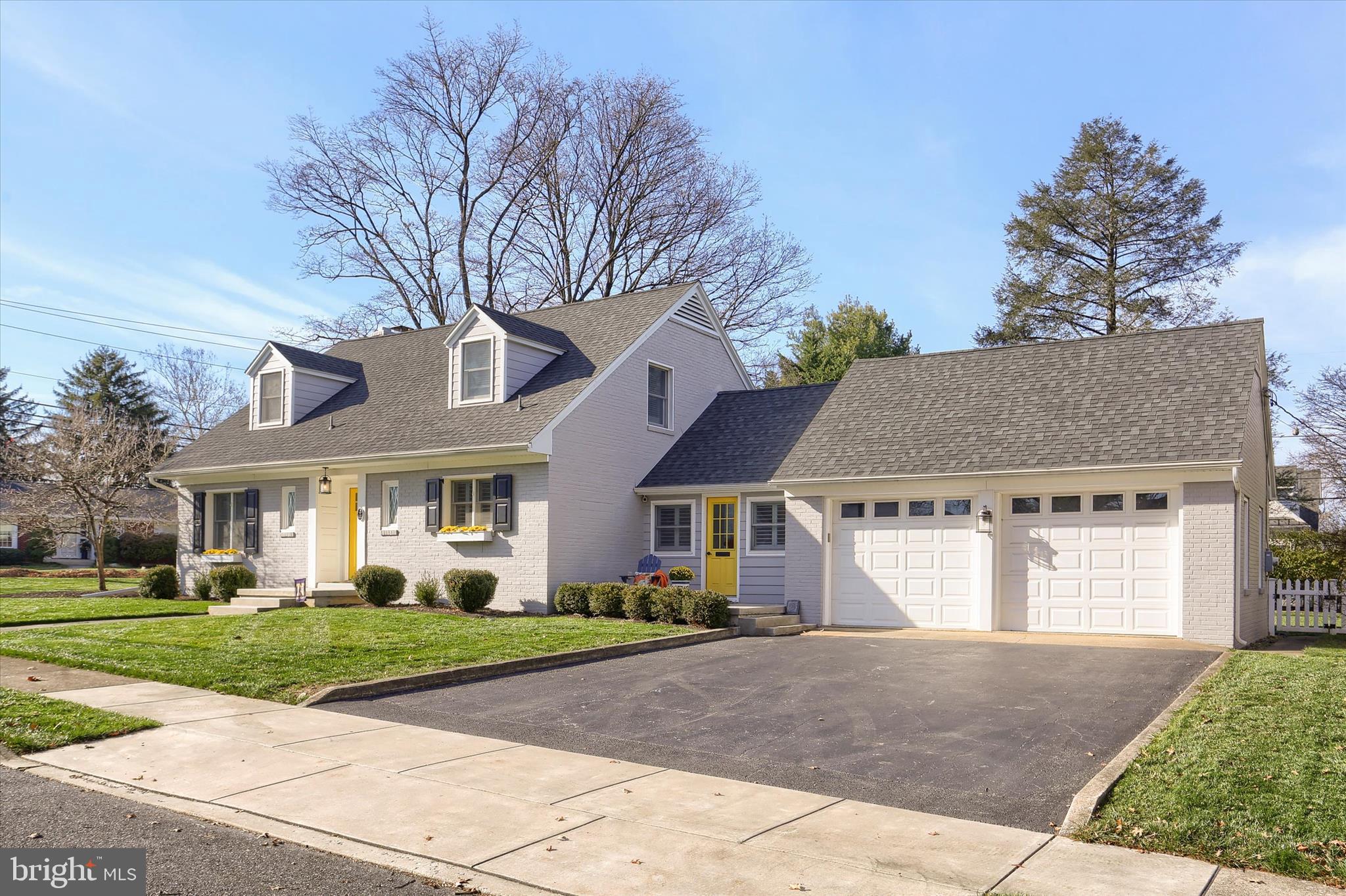 155 Oak Lane Hershey, PA 17033 - Photo 40 of 54 a front view of a house with a yard and garage