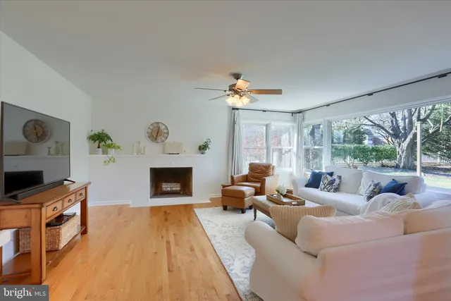 a large kitchen with stainless steel appliances granite countertop a sink and dishwasher a stove top oven with wooden floor