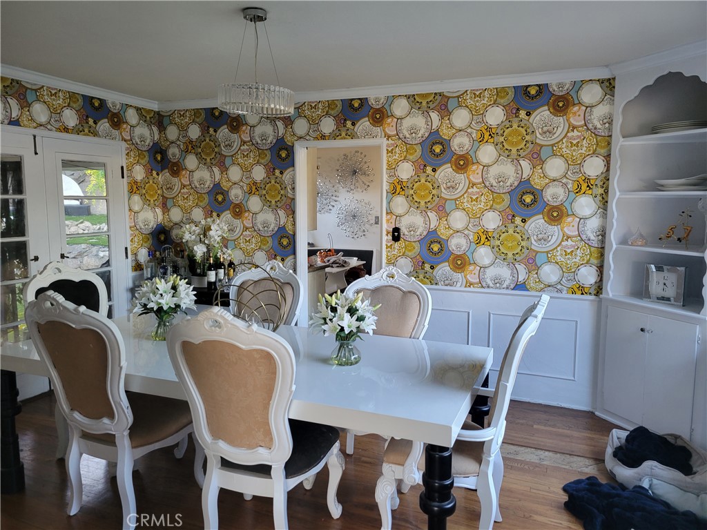 4600 9th Street Riverside, CA 92501 - Photo 11 of 21 a view of a dining room with furniture window and wooden floor
