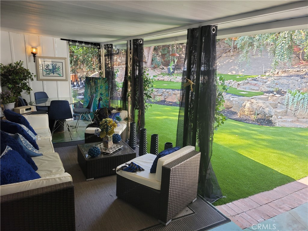 4600 9th Street Riverside, CA 92501 - Photo 19 of 20 a living room with furniture and a garden