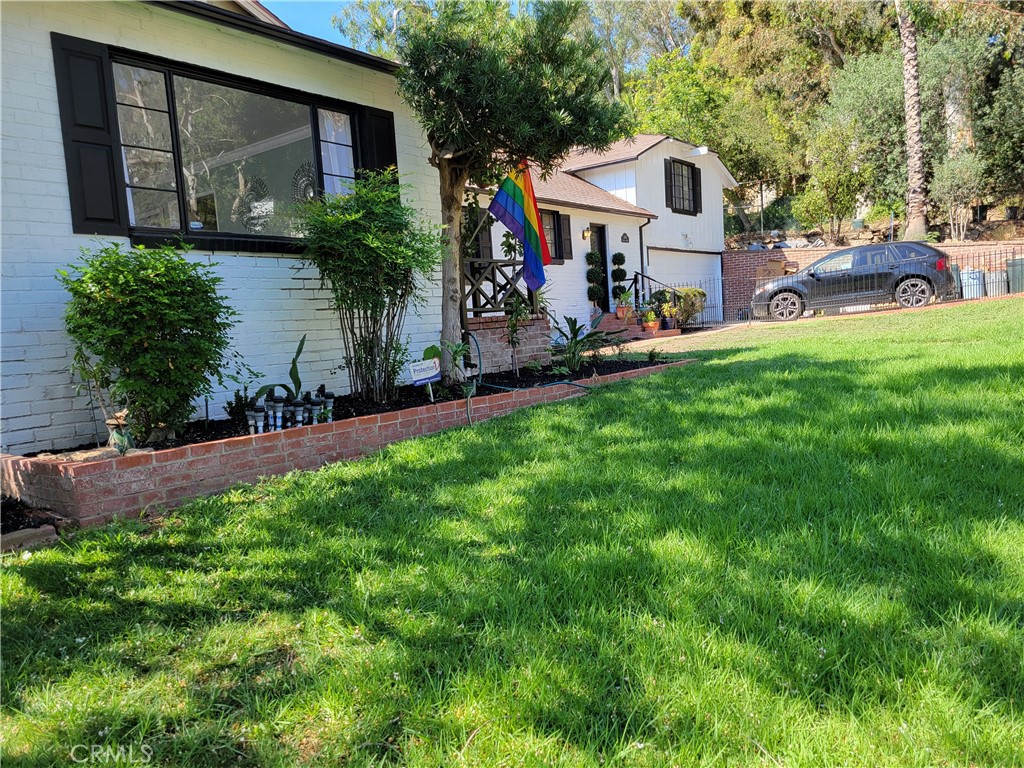 4600 9th Street Riverside, CA 92501 - Photo 4 of 21 a view of a house with a yard and sitting area