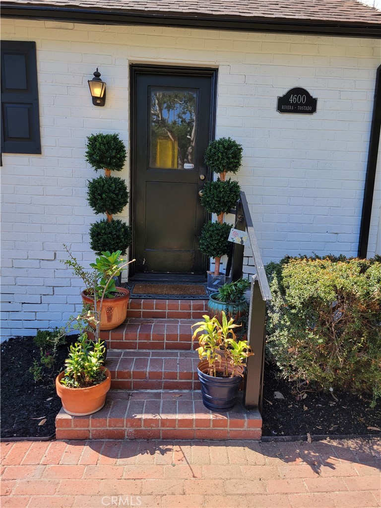 4600 9th Street Riverside, CA 92501 - Photo 7 of 21 a front view of a house with a yard