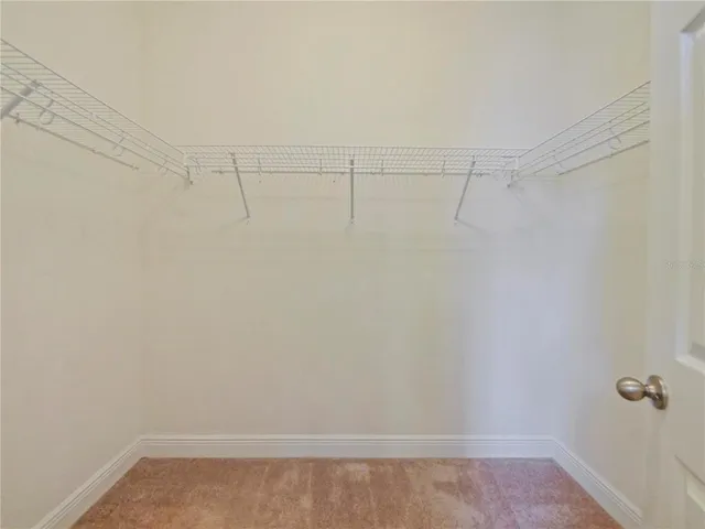 a view of a room with racks on the wall