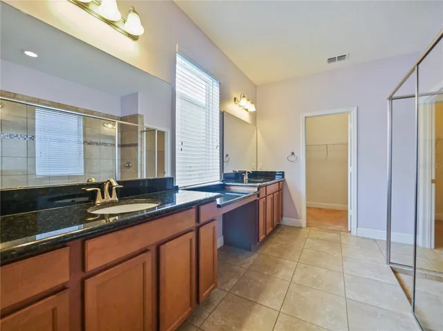 a large bathroom with a large tub and sink
