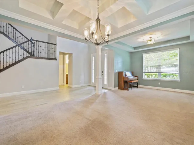 a view of a livingroom with furniture and a workspace