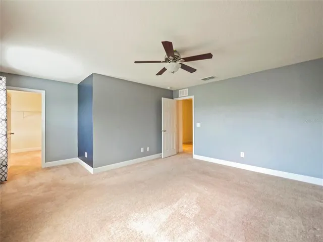 a bathroom with a double vanity sink a mirror and a bathtub