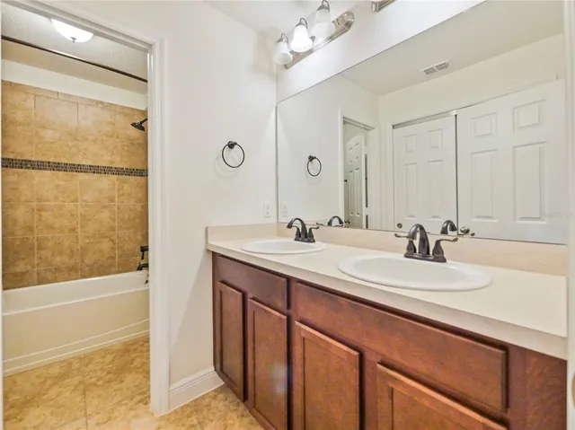 a view of hallway with wooden floor