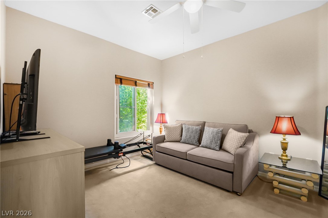 2738 Grand Forks Road Henderson, NV 89052 - Photo 27 of 52 Carpeted flooring and neutral walls create a comfortable and versatile bonus room layout.