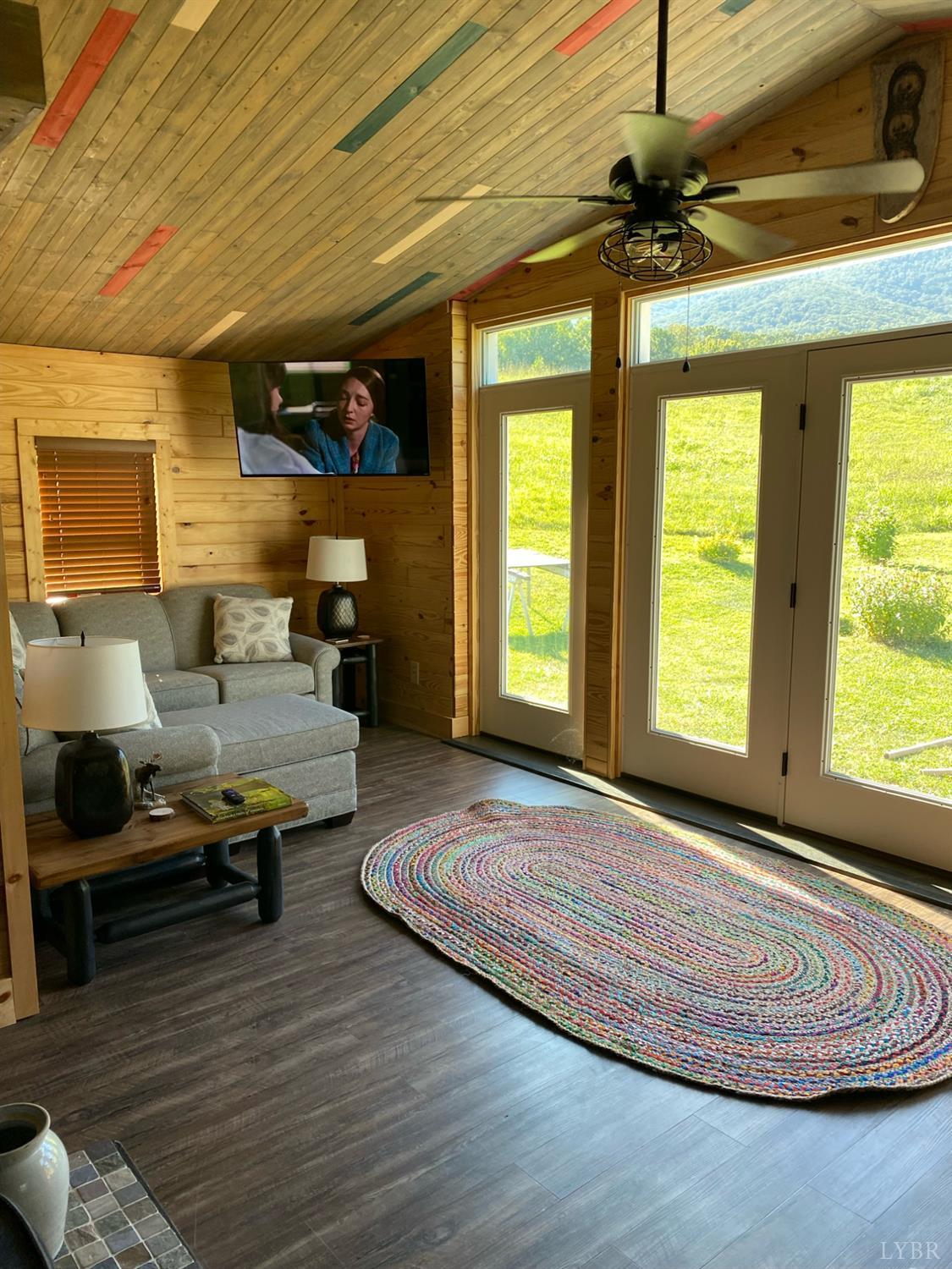 7392 Peaks Road Bedford, VA 24523 - Photo 13 of 48 a living room with furniture and a large window