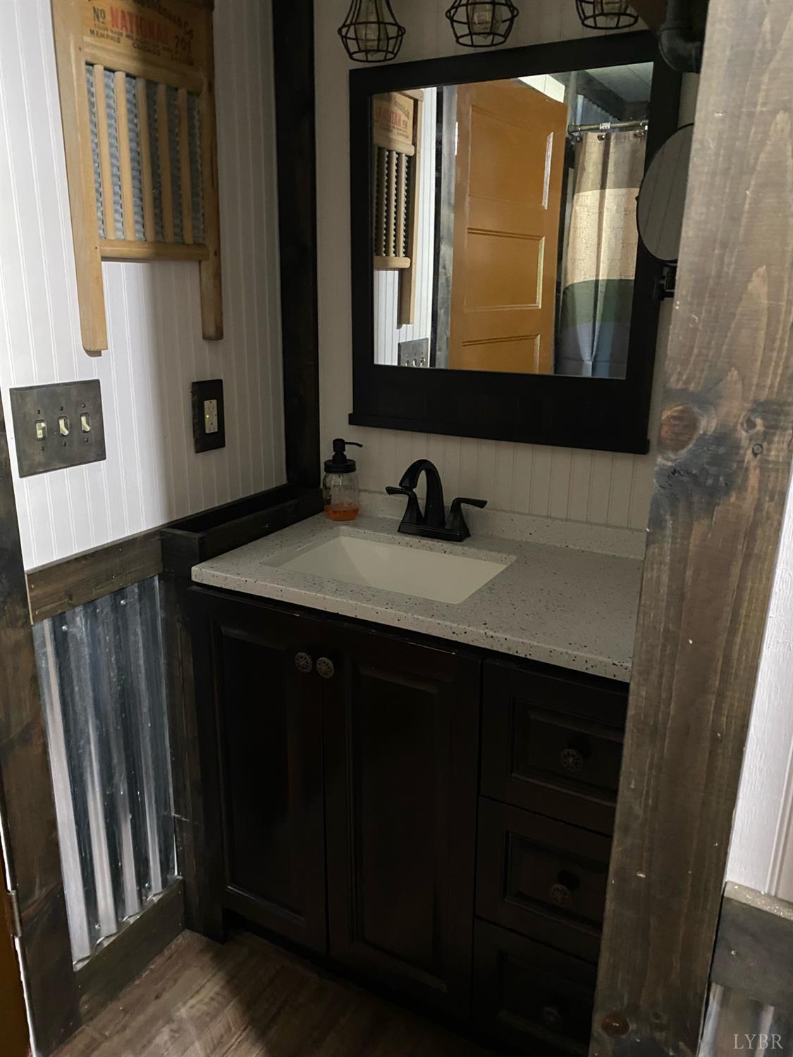 7392 Peaks Road Bedford, VA 24523 - Photo 19 of 48 a bathroom with a sink a mirror and bathtub