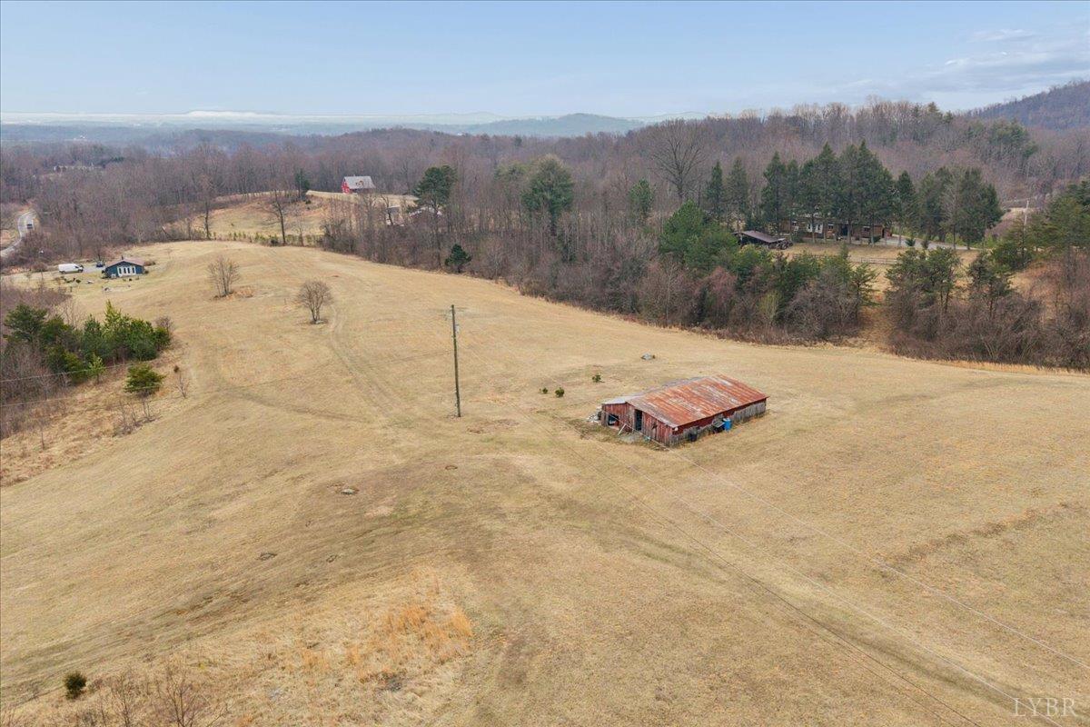 7392 Peaks Road Bedford, VA 24523 - Photo 3 of 48 an aerial view of a house with a yard and mountain view in back