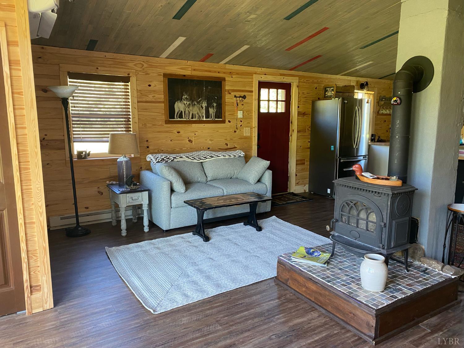 7392 Peaks Road Bedford, VA 24523 - Photo 43 of 48 a living room with furniture and a wooden floor