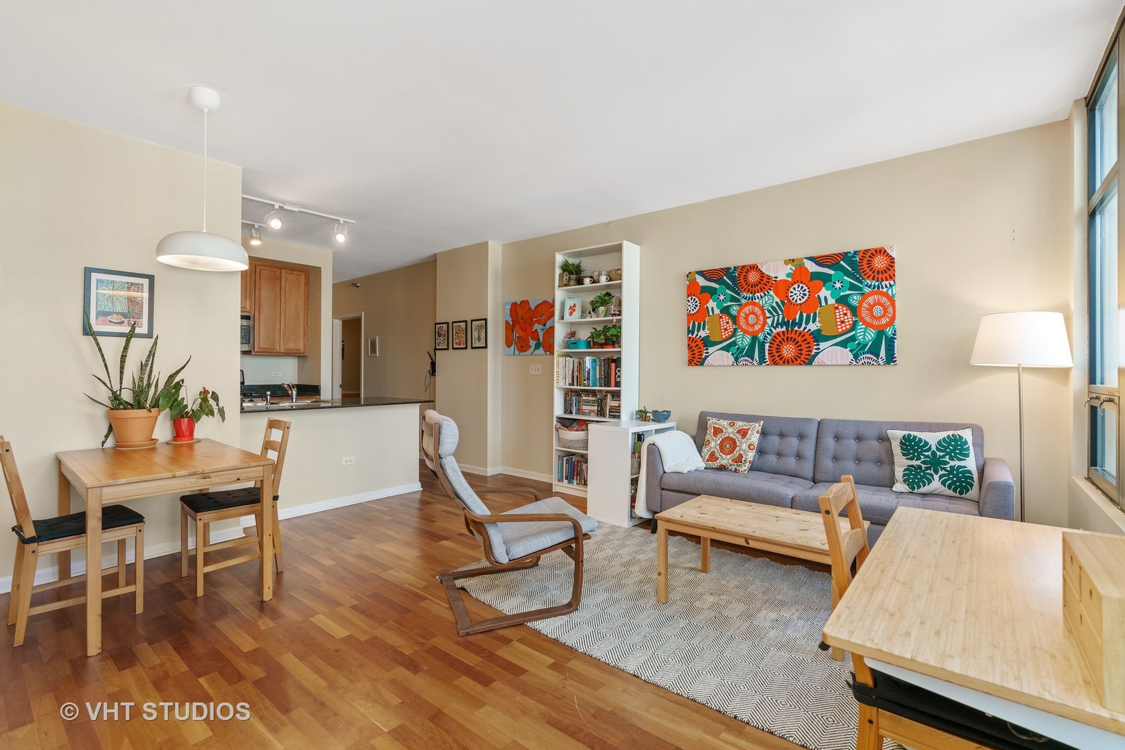 1255 South State Street, Unit 1809 Chicago, IL 60605 - Photo 3 of 11 a living room with furniture and kitchen view with wooden floor
