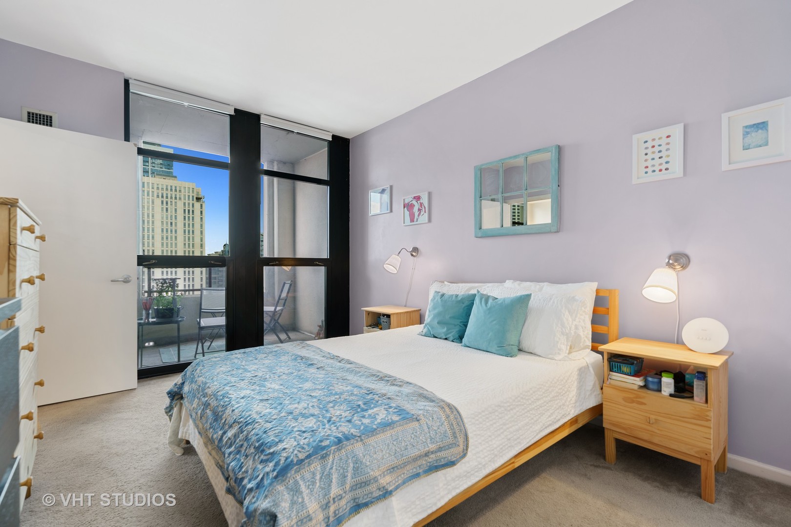 1255 South State Street, Unit 1809 Chicago, IL 60605 - Photo 7 of 11 a bedroom with a bed and a refrigerator