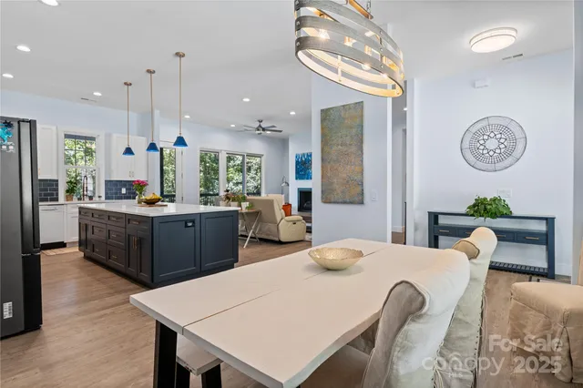 a large kitchen with a table and chairs