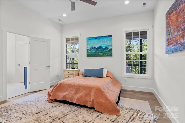 a bedroom with a large bed and a window