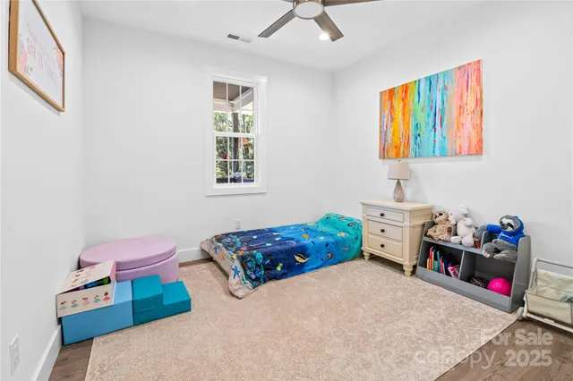 a bedroom with bed and a window