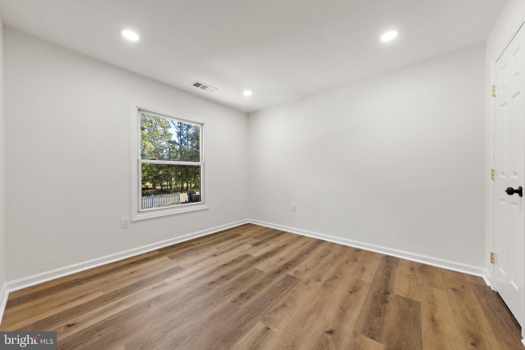716 6th Road Newtonville, NJ 08346 - Photo 16 of 43 a view of an empty room with a window
