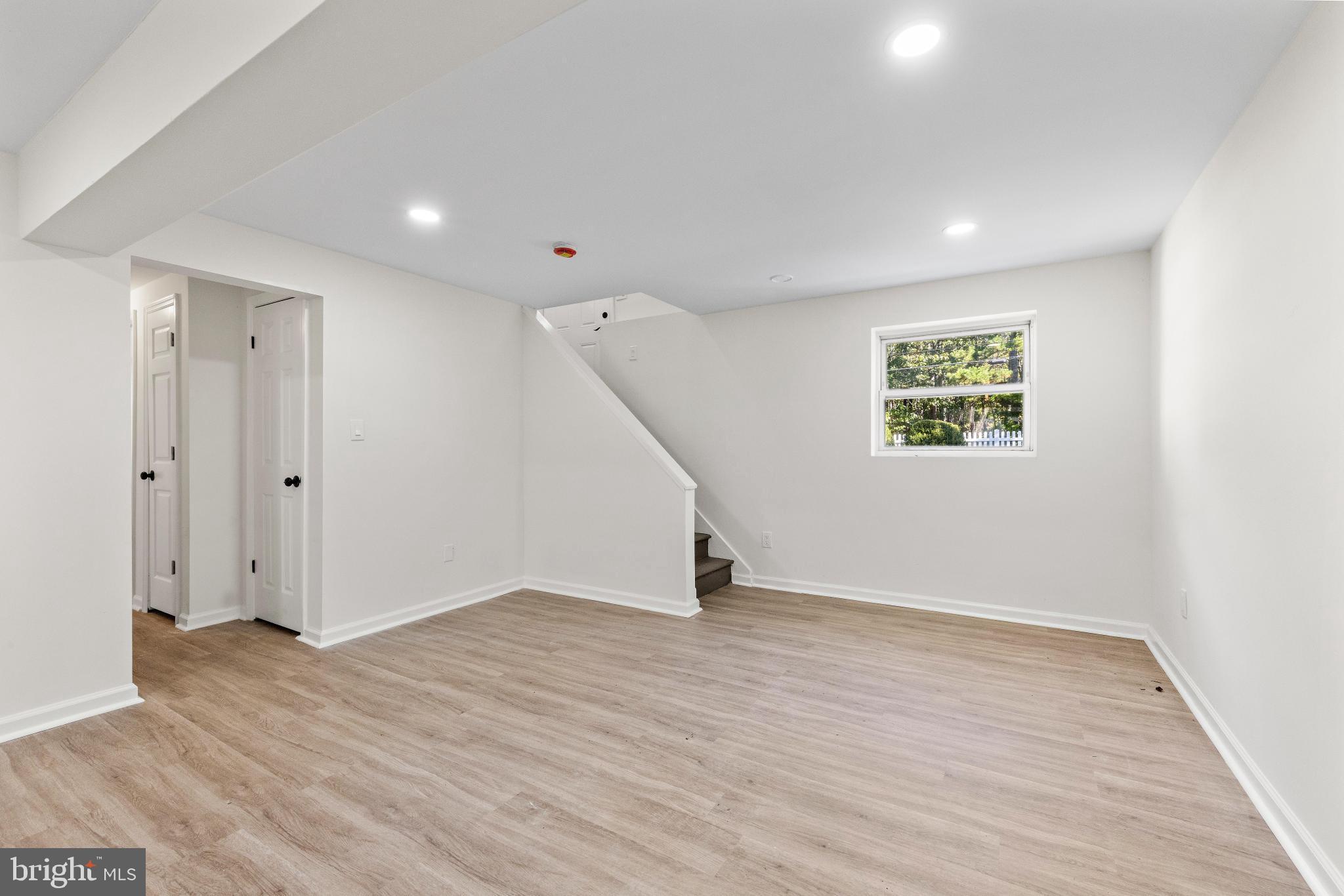 716 6th Road Newtonville, NJ 08346 - Photo 28 of 43 wooden floor in an empty room with a window