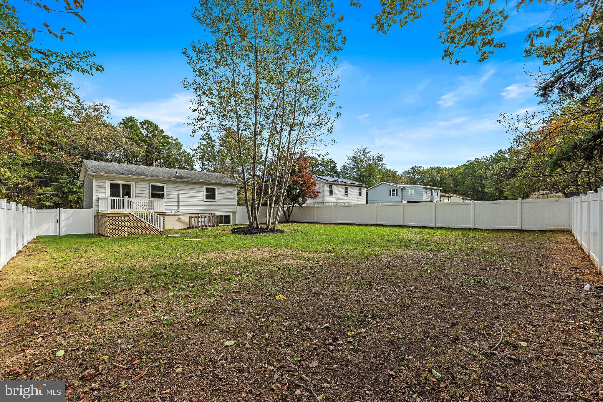 716 6th Road Newtonville, NJ 08346 - Photo 35 of 43 a view of a house with backyard and trees