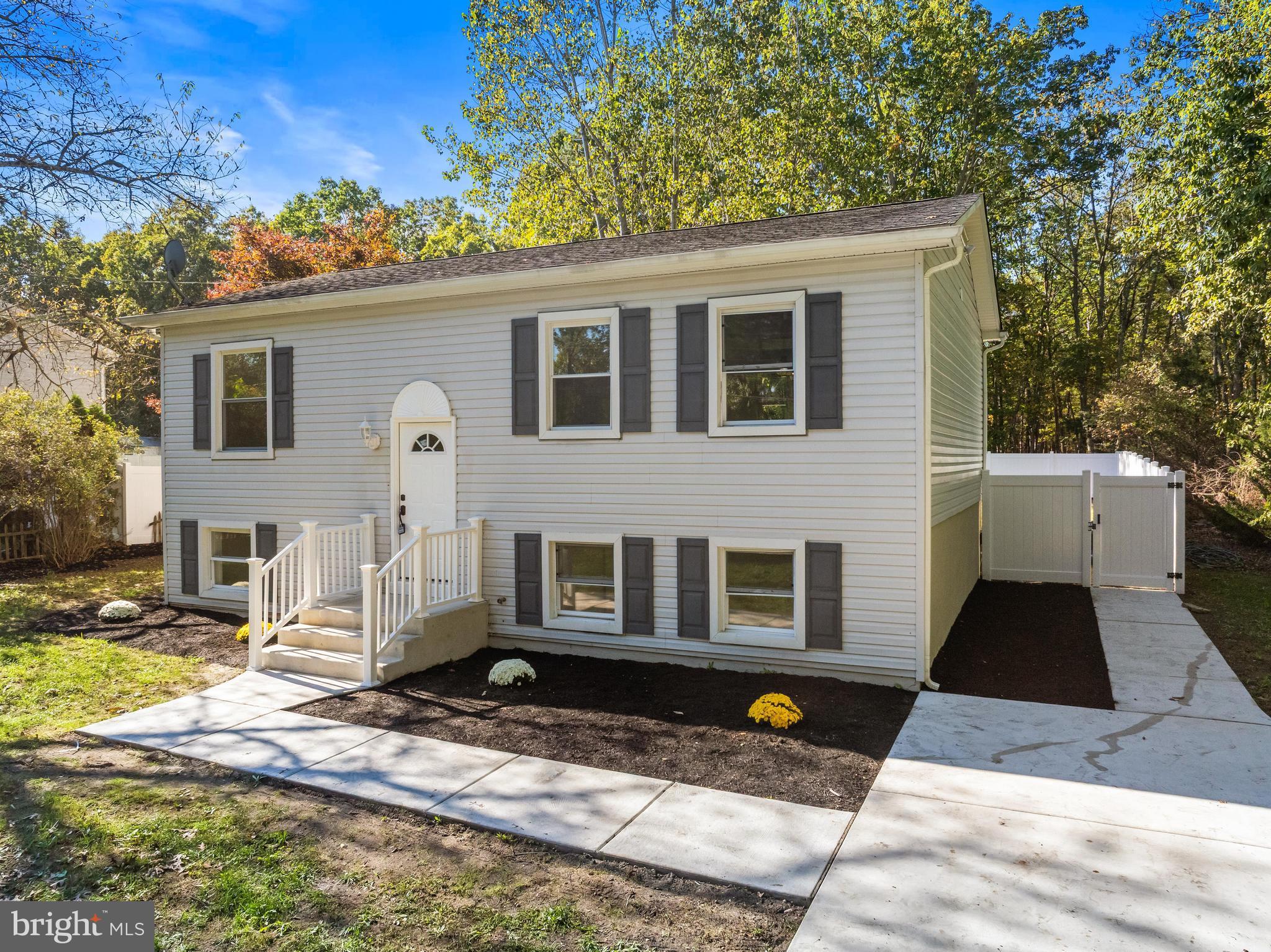 716 6th Road Newtonville, NJ 08346 - Photo 5 of 43 a front view of a house with a yard
