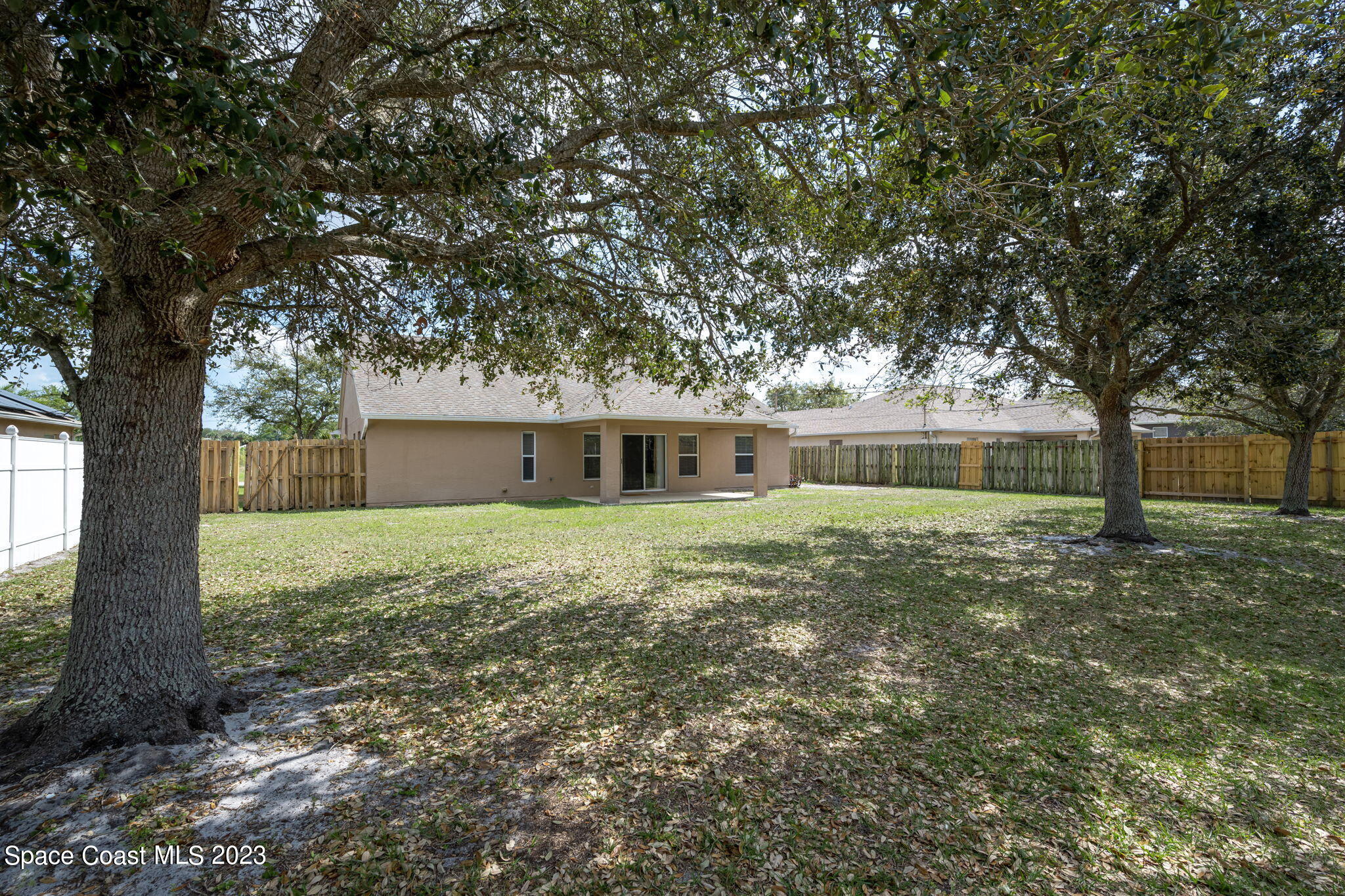 167 Spring Valley Avenue Sebastian, FL 32958 - Photo 34 of 34 a front view of a house with a garden