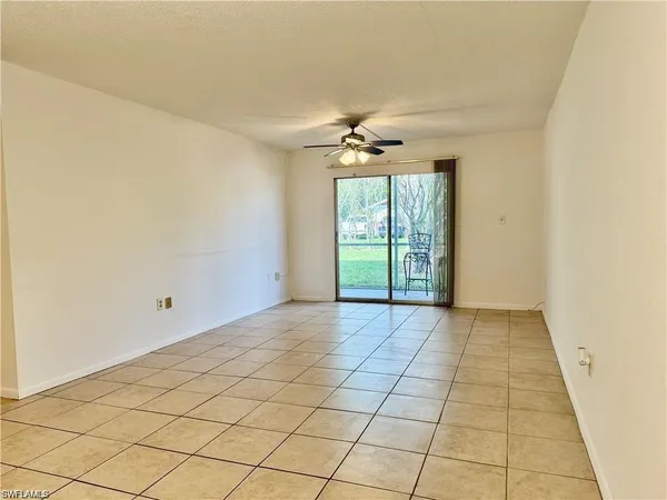 a view of an empty room and a window