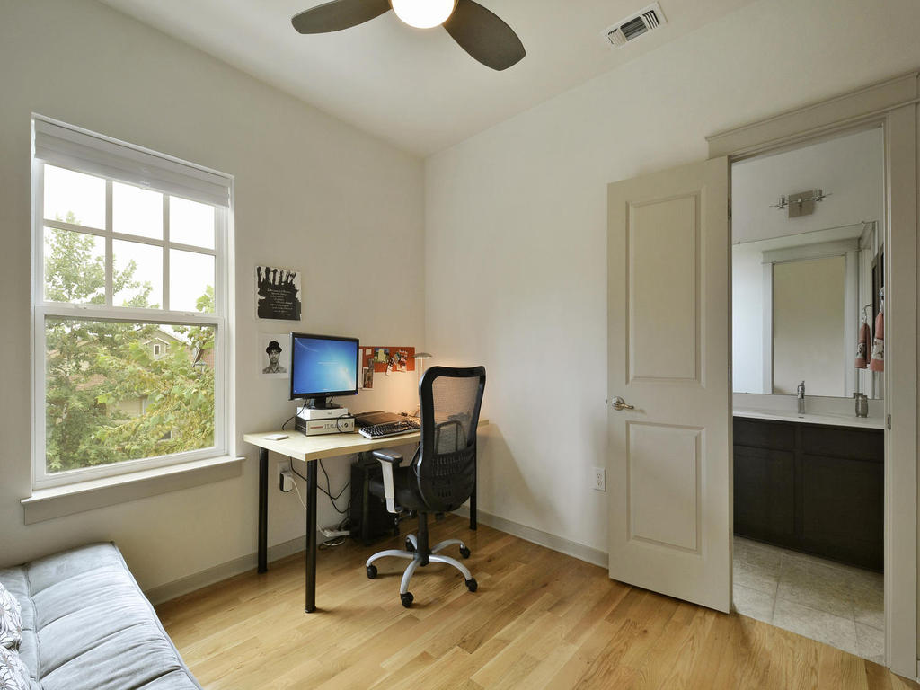 3900 Threadgill Street, Unit 32 Austin, TX 78723 - Photo 25 of 30 Gleaming hardwood floors and a multi-pane window elevate this versatile office space.