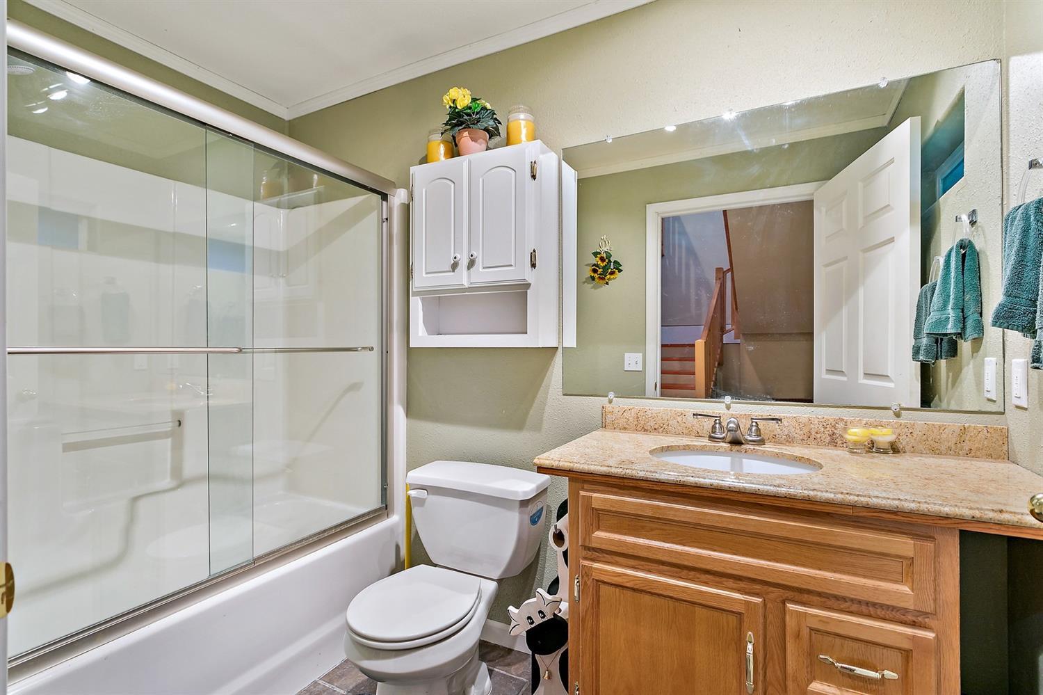 4930 Leonard Road Grants Pass, OR 97527 - Photo 29 of 33 a bathroom with a sink a toilet and shower