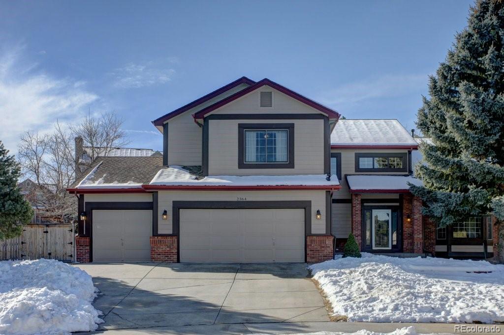 2364 Stratford Court Highlands Ranch, CO 80126 - Photo 1 of 35 a front view of a house with yard and parking