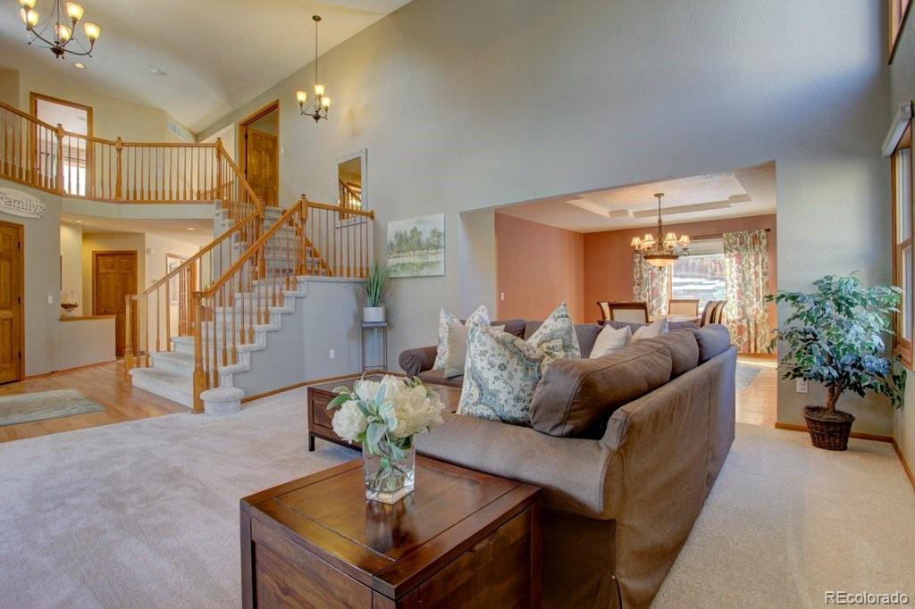 2364 Stratford Court Highlands Ranch, CO 80126 - Photo 16 of 35 a living room with furniture and wooden floor